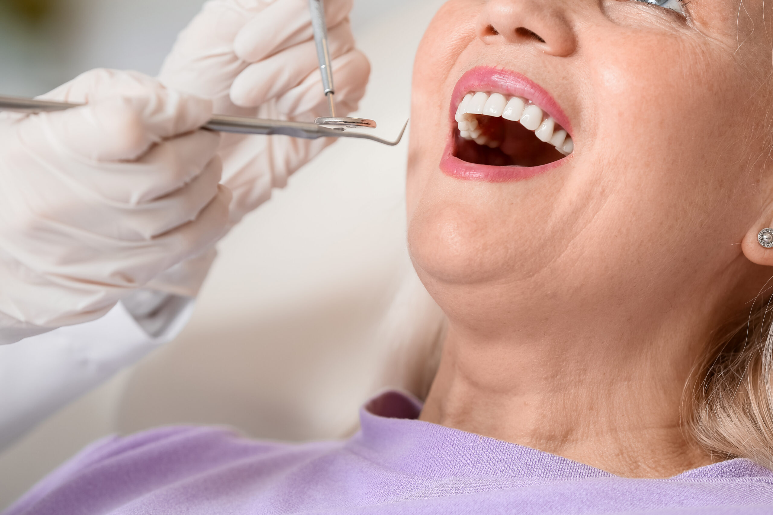 Mature woman visiting dentist in clinic