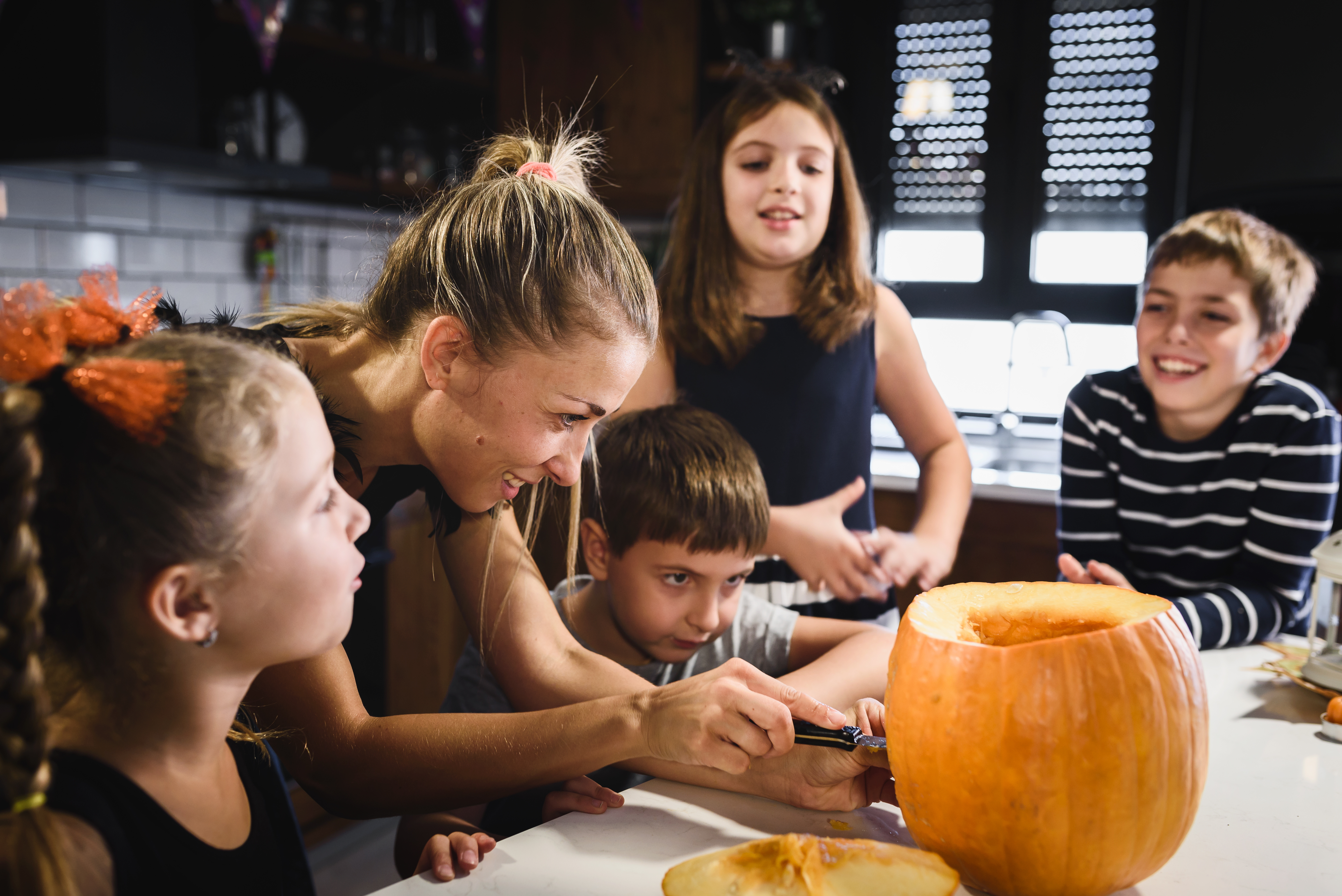 prevention cedar rapids family carving pumpkins